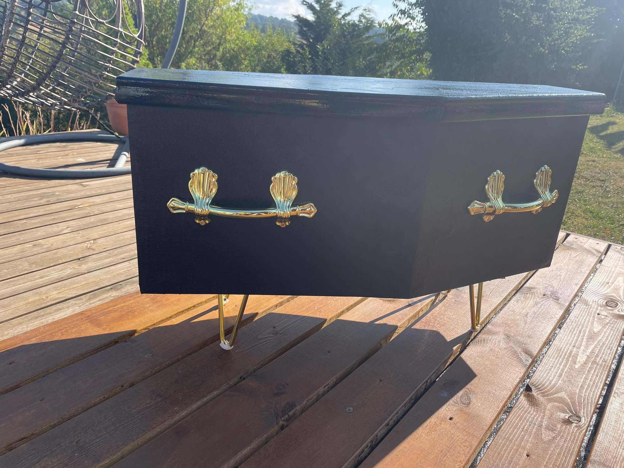 Black coffin storage piece
