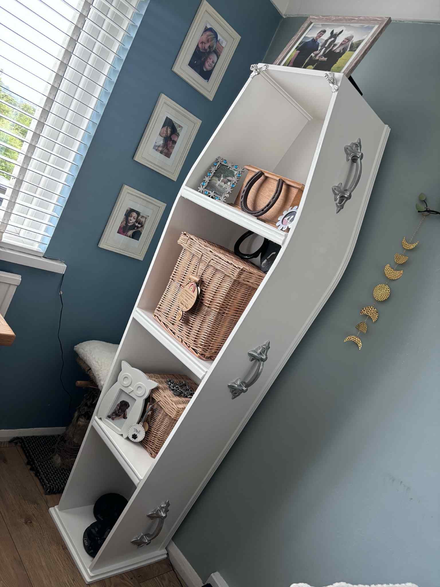 White coffin display shelving